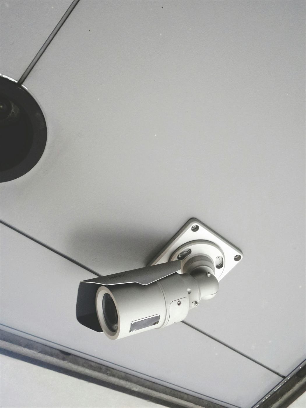 Bullet CCTV camera mounted on a building ceiling